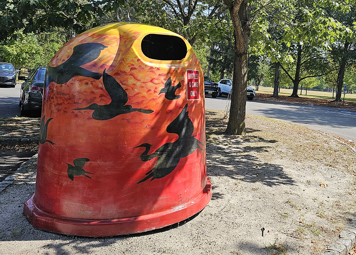 red recycling container in park