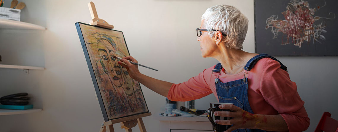 Woman painting in room