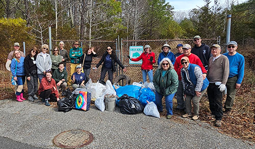 group of people cleaning park